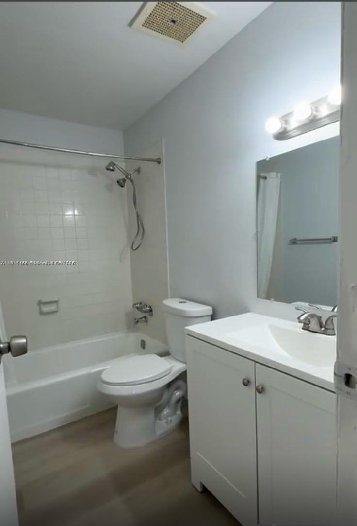 17901 Northwest 68th Avenue, Unit T205 Hialeah, FL 33015 - Photo 12 of 13 a bathroom with a sink toilet and shower