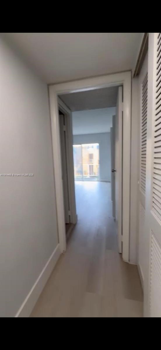 17901 Northwest 68th Avenue, Unit T205 Hialeah, FL 33015 - Photo 5 of 13 a view of a hallway