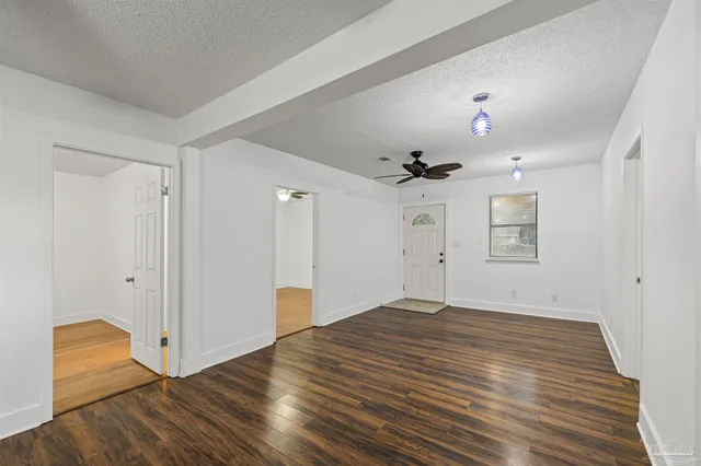 a kitchen with white cabinets sink and stainless steel appliances