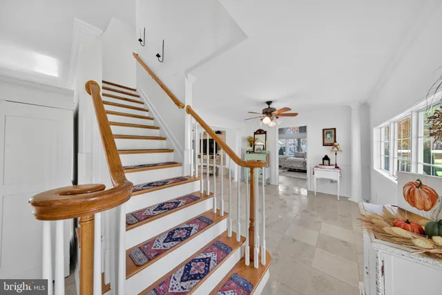 a white toilet sitting next to a bathroom sink