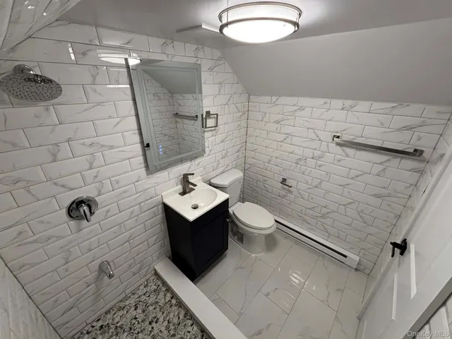 a bedroom with a bed and a chair