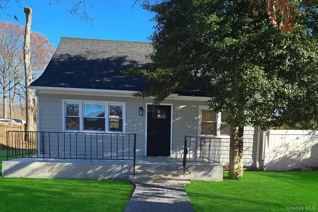 a kitchen with a refrigerator sink and cabinets