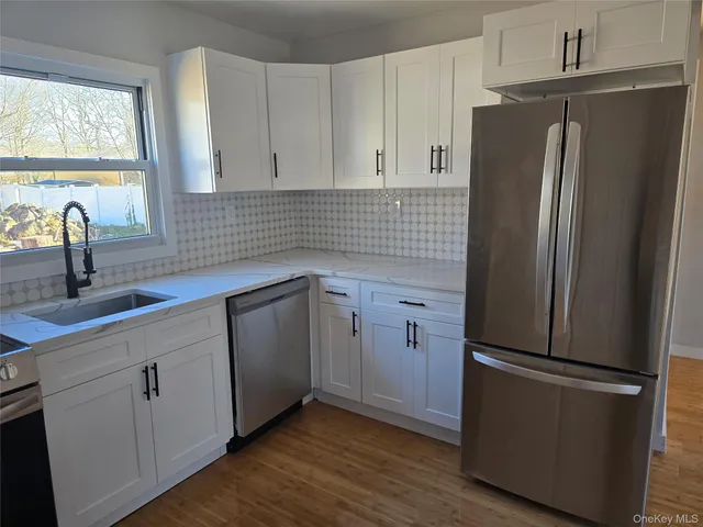 a bathroom with a toilet and a bath tub