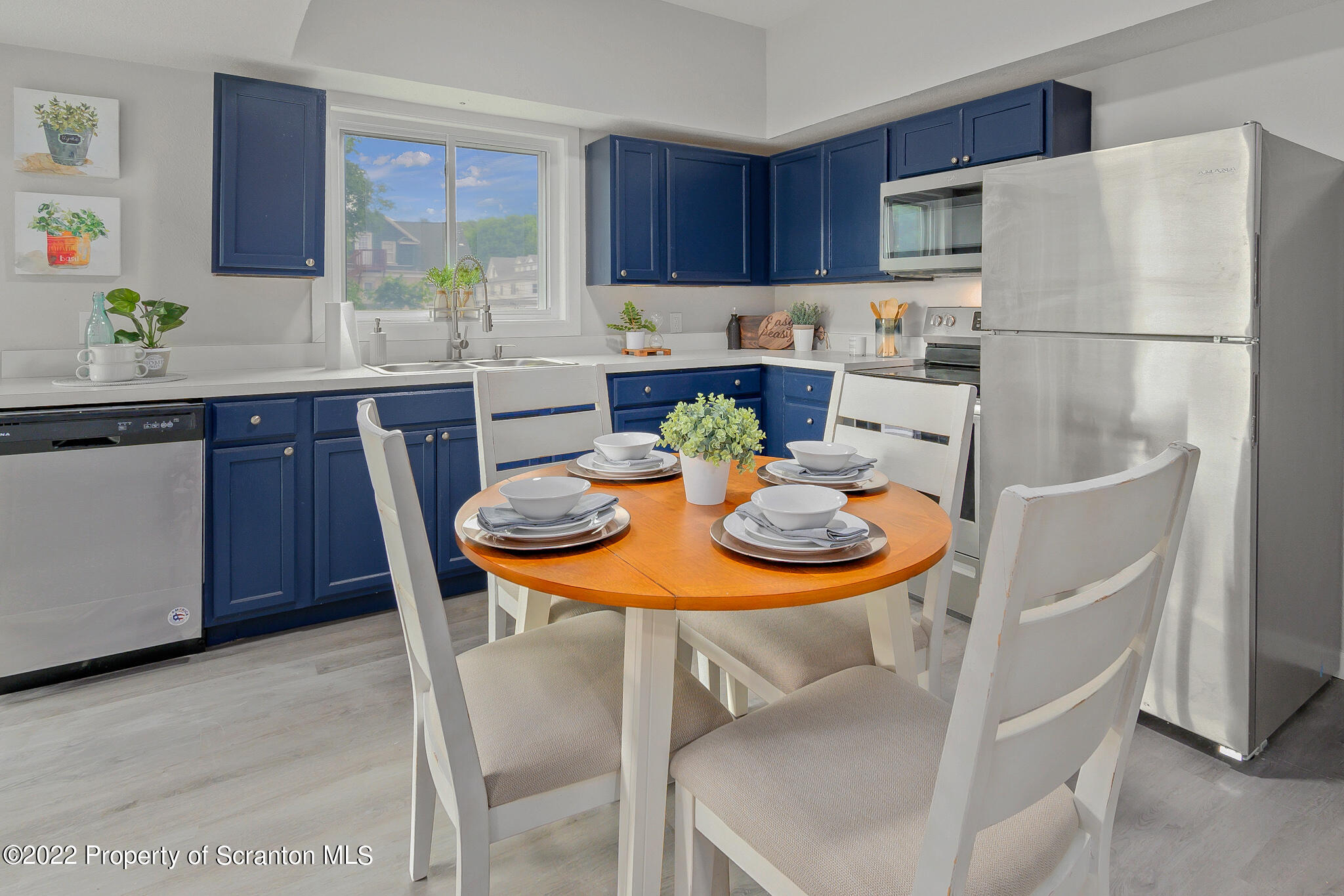 533 Cherry Street Scranton, PA 18505 - Photo 12 of 33 a kitchen with stainless steel appliances a table and chairs