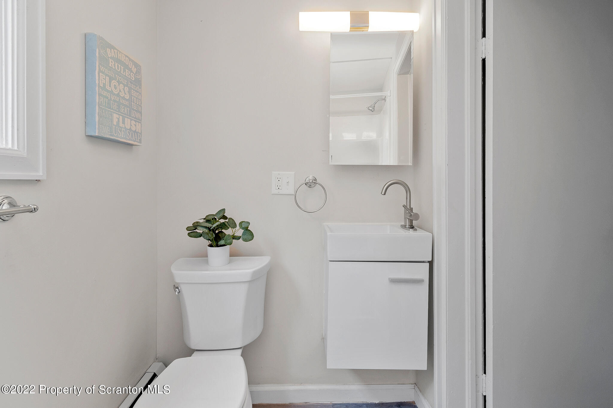 533 Cherry Street Scranton, PA 18505 - Photo 27 of 33 a bathroom with a toilet sink and mirror