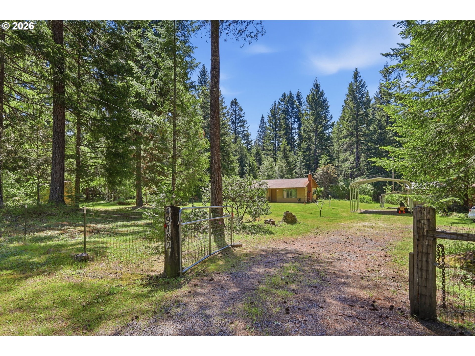 49782 Huckleberry Road Oakridge, OR 97463 - Photo 3 of 21 a view of a park with large trees