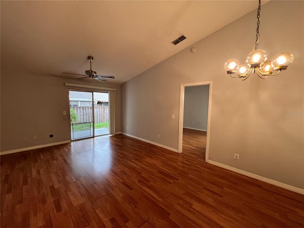 7771 Country Place, Unit 7 Winter Park, FL 32792 - Photo 2 of 15 a view of livingroom with hardwood floor and window