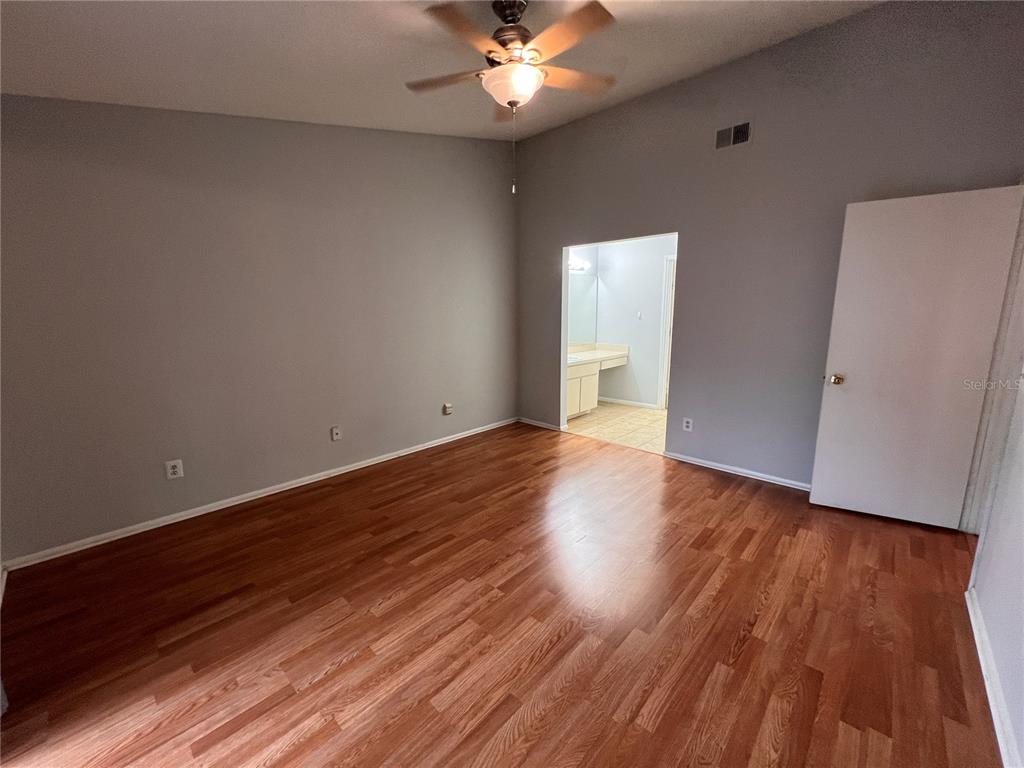 7771 Country Place, Unit 7 Winter Park, FL 32792 - Photo 6 of 15 wooden floor in an empty room with a window