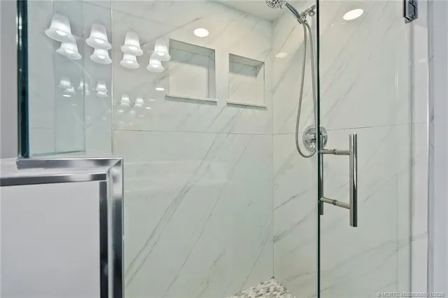 a bathroom with a mirror and a shower