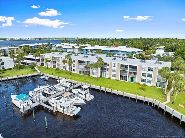 a view of a terrace with lawn chairs