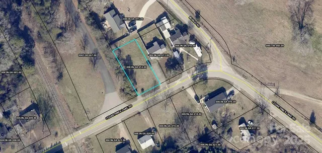 a view of a house with a tree