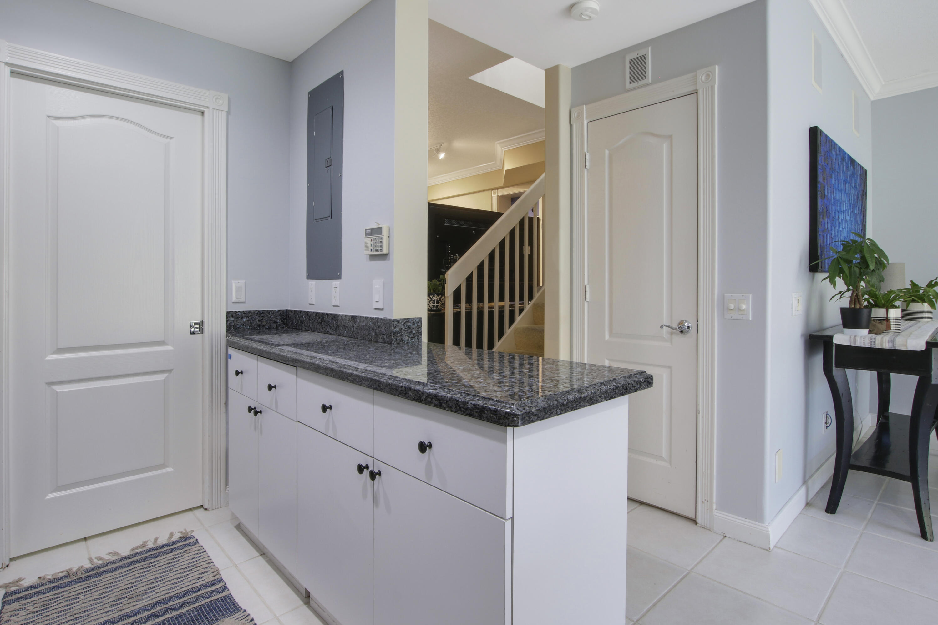 153 Andover Drive Jupiter, FL 33458 - Photo 11 of 25 a bathroom with a granite countertop sink and a mirror