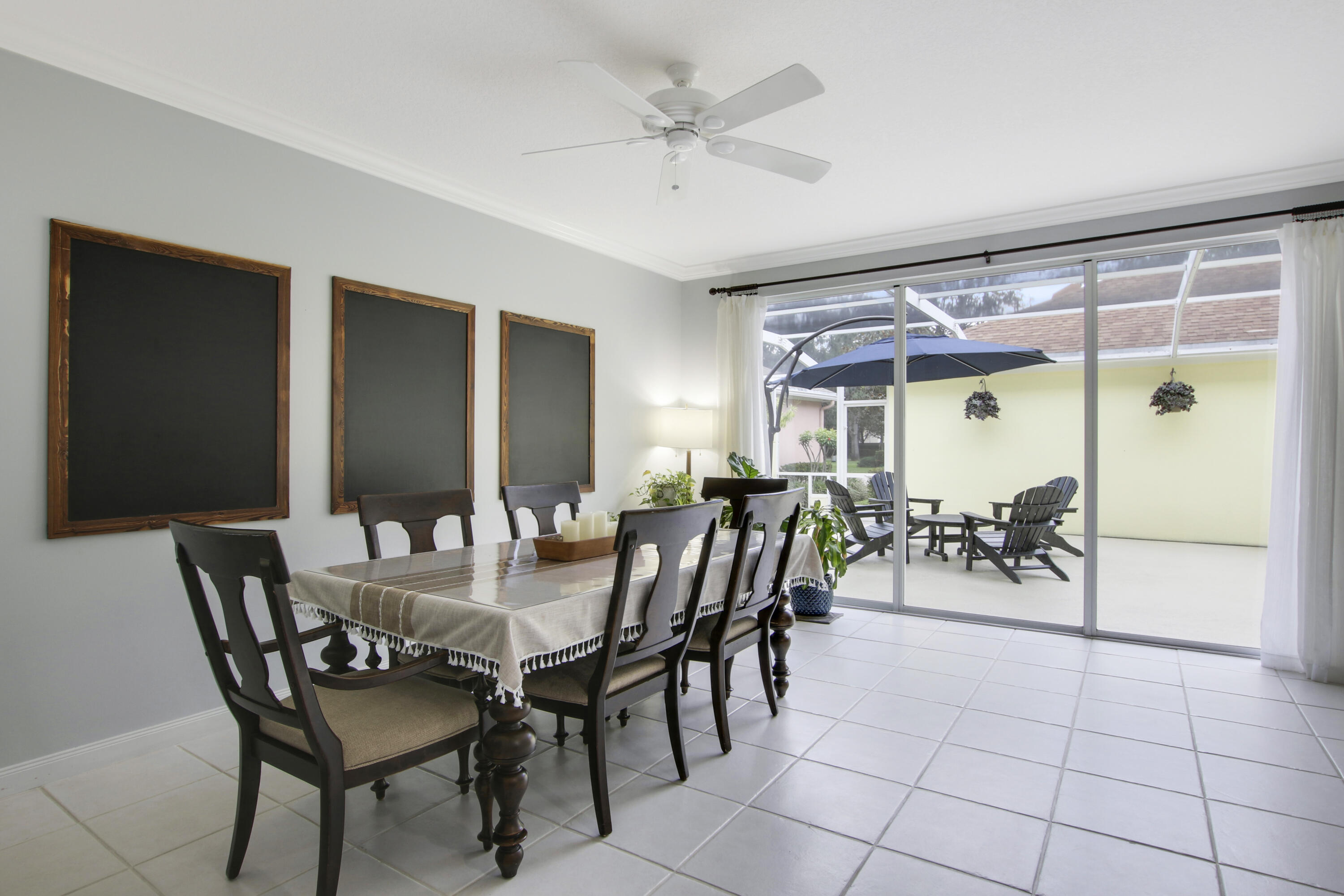 153 Andover Drive Jupiter, FL 33458 - Photo 13 of 25 a view of a dining room with furniture and a chandelier