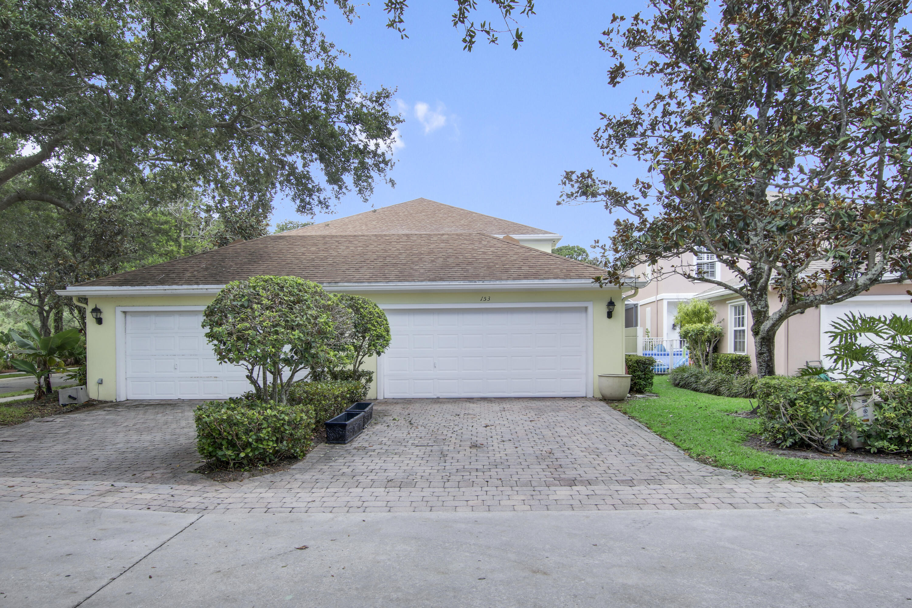 153 Andover Drive Jupiter, FL 33458 - Photo 25 of 25 front view of a house with a yard