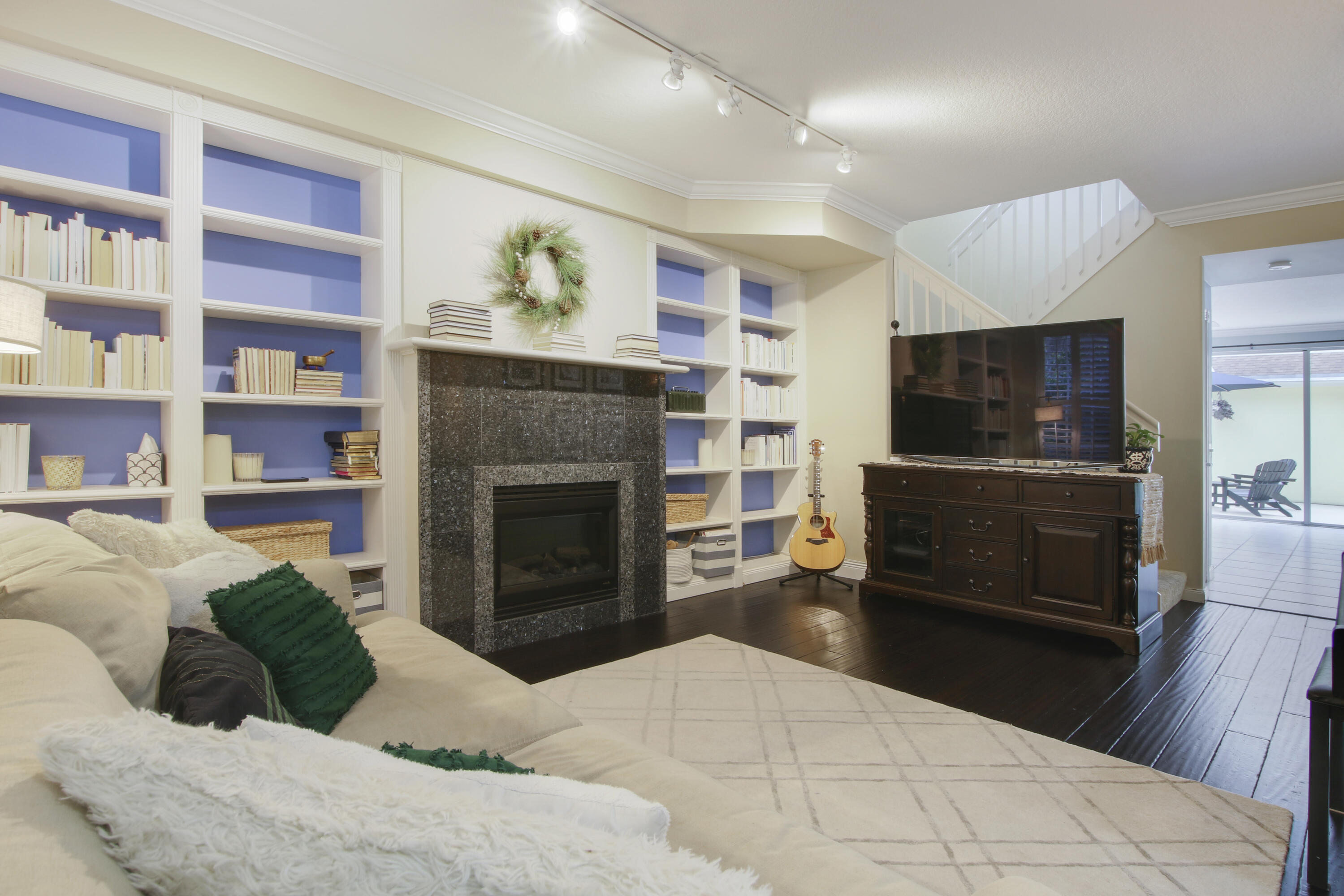 153 Andover Drive Jupiter, FL 33458 - Photo 7 of 25 a living room with furniture and a fireplace