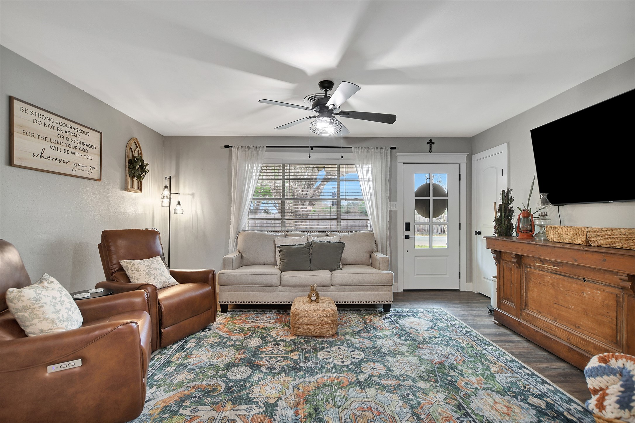 205 Munz Street Brenham, TX 77833 - Photo 11 of 48 a living room with furniture and a flat screen tv