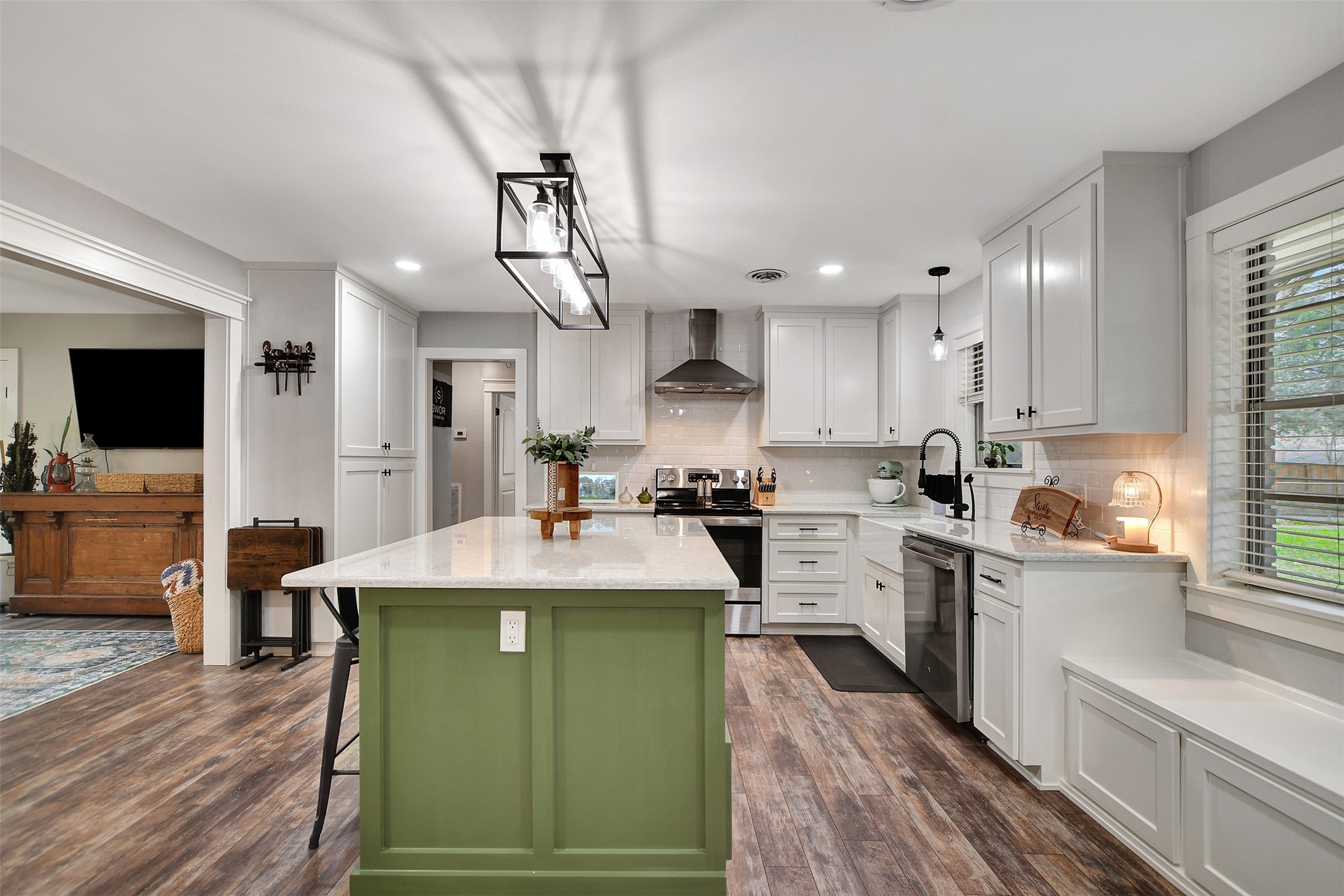 205 Munz Street Brenham, TX 77833 - Photo 14 of 48 a kitchen with cabinets a sink and appliances