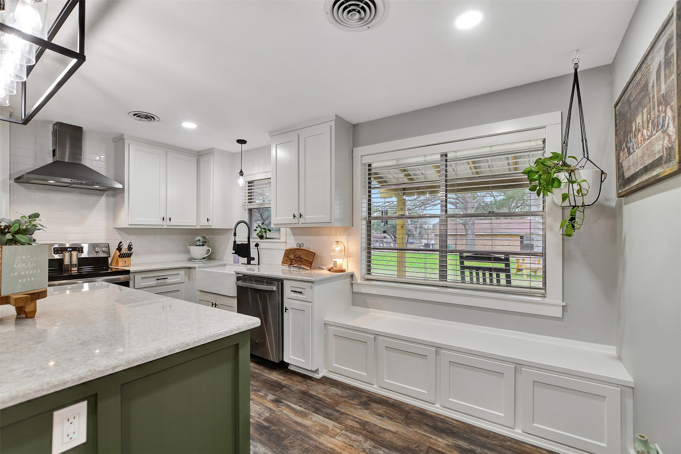 205 Munz Street Brenham, TX 77833 - Photo 19 of 48 a kitchen with stainless steel appliances granite countertop a sink a stove a refrigerator cabinets and a window