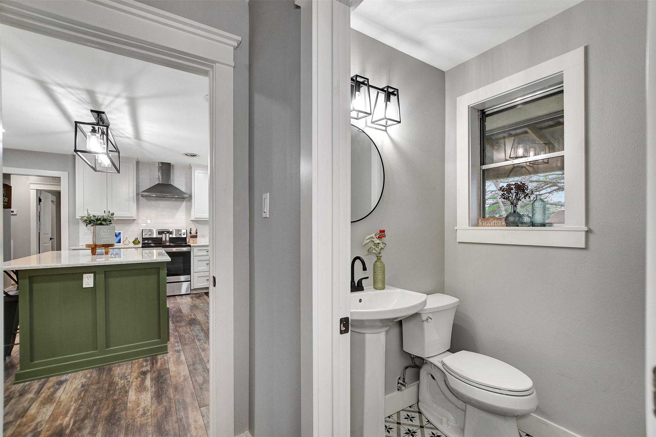 205 Munz Street Brenham, TX 77833 - Photo 29 of 48 a bathroom with a toilet sink and mirror