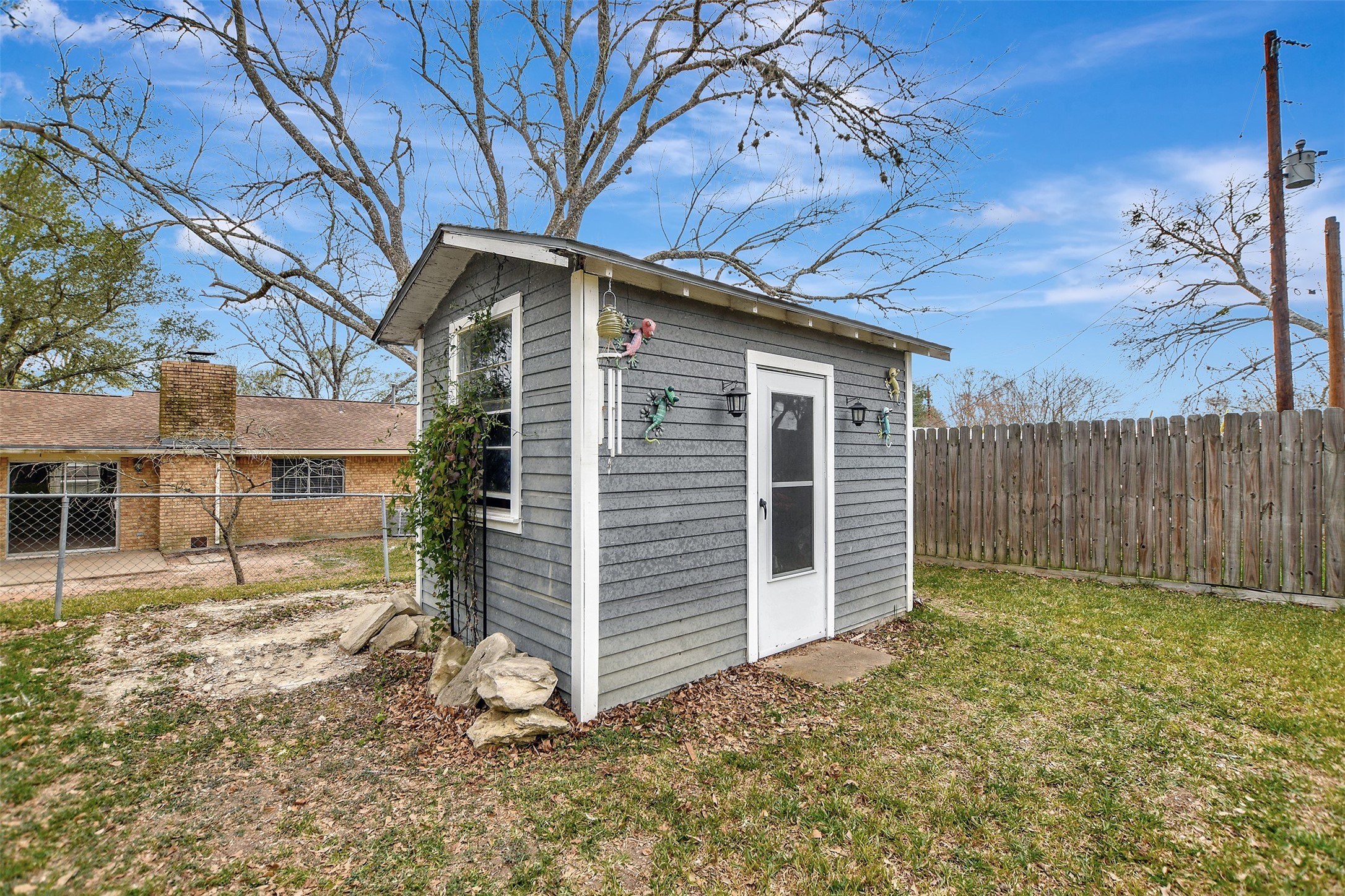 205 Munz Street Brenham, TX 77833 - Photo 36 of 48 a front view of a house with a yard