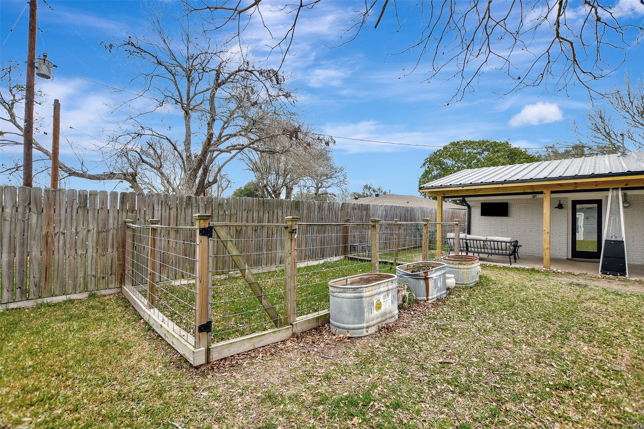 205 Munz Street Brenham, TX 77833 - Photo 37 of 48 a view of a house with backyard and sitting area