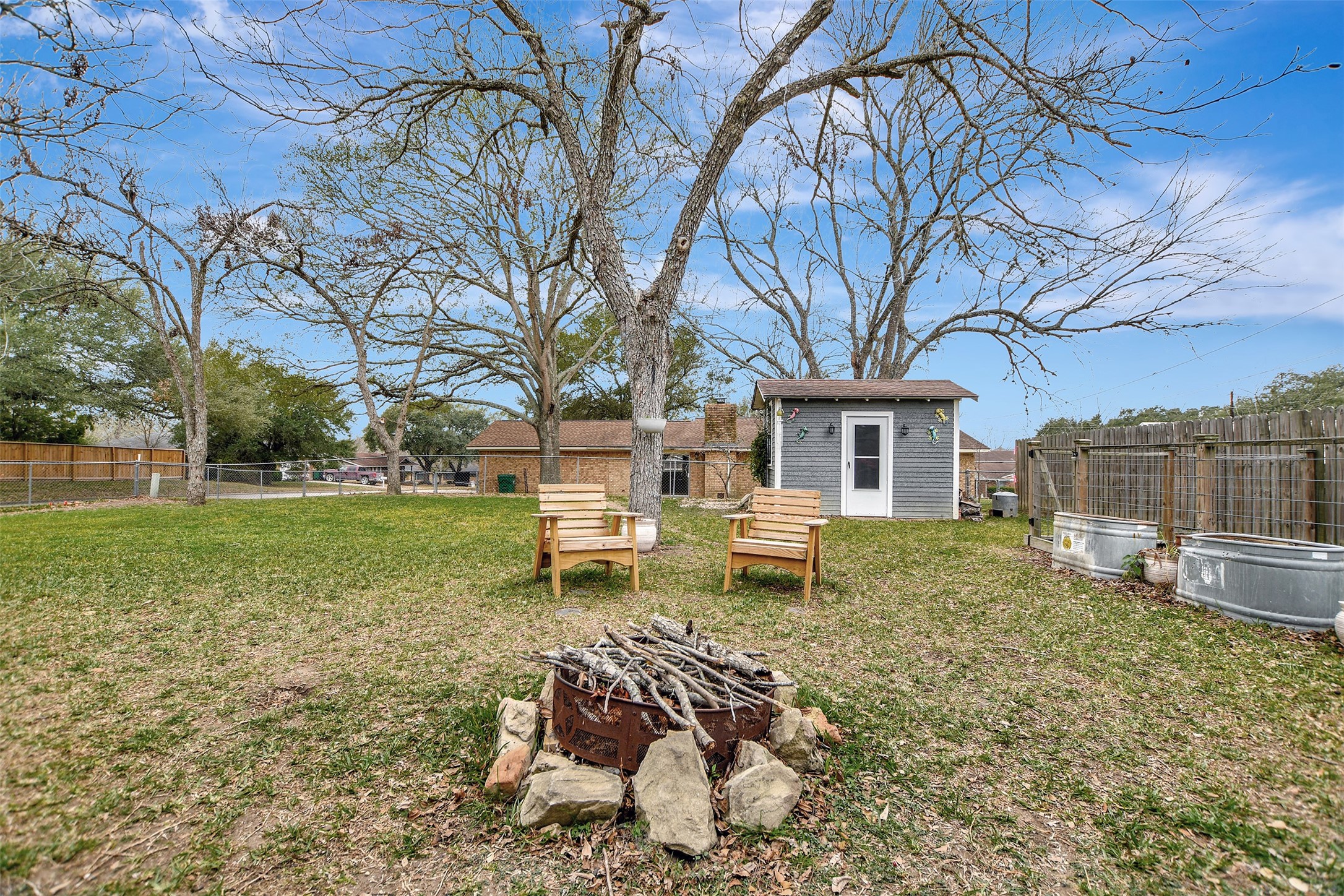 205 Munz Street Brenham, TX 77833 - Photo 38 of 48 a view of a house with backyard and sitting area
