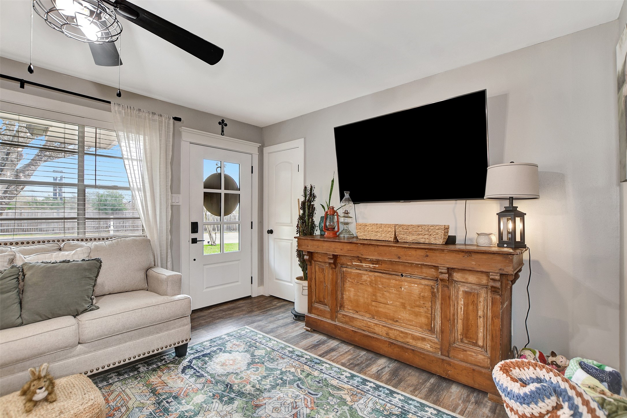205 Munz Street Brenham, TX 77833 - Photo 6 of 48 a living room with furniture and a flat screen tv