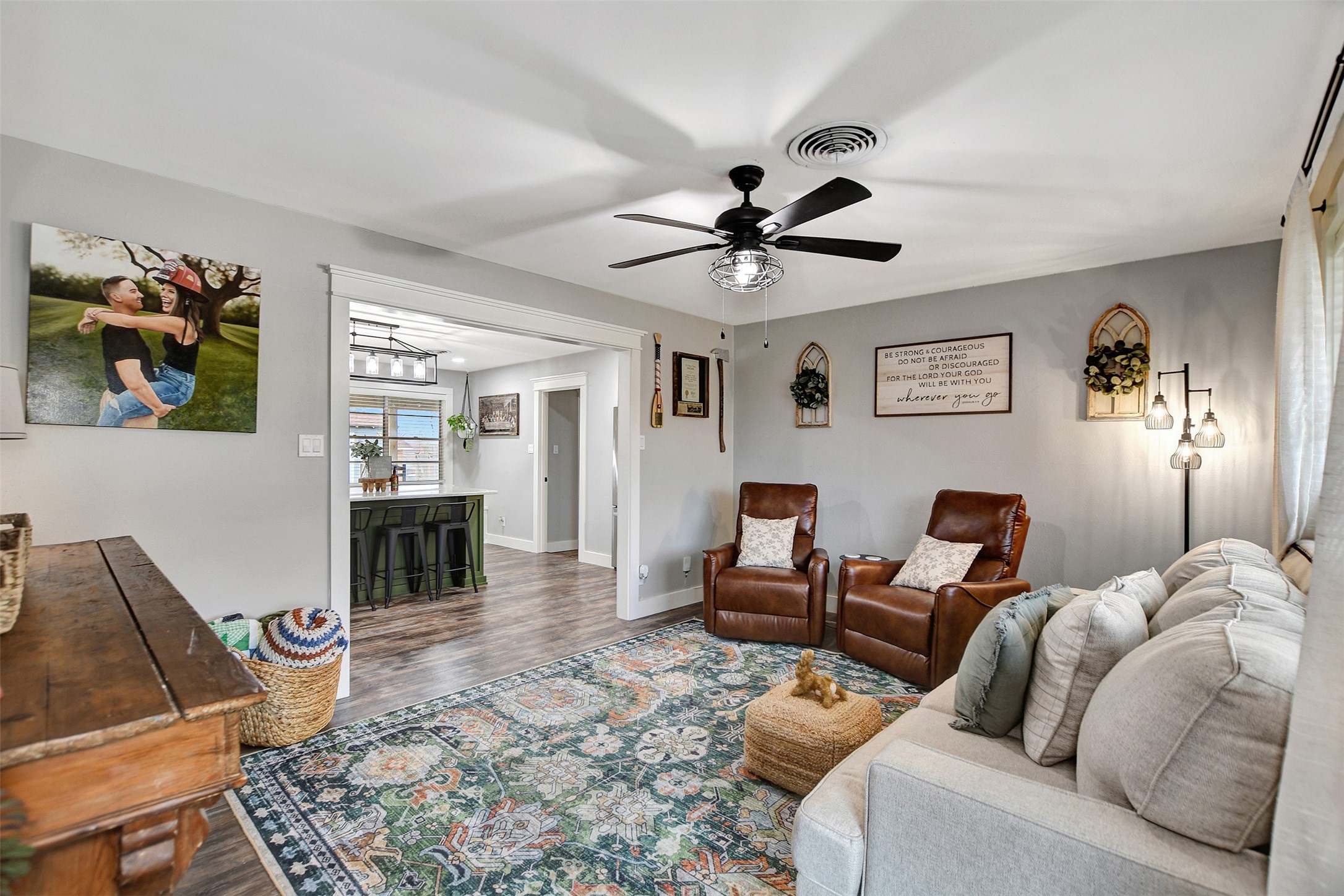 205 Munz Street Brenham, TX 77833 - Photo 7 of 48 a living room with furniture and a flat screen tv