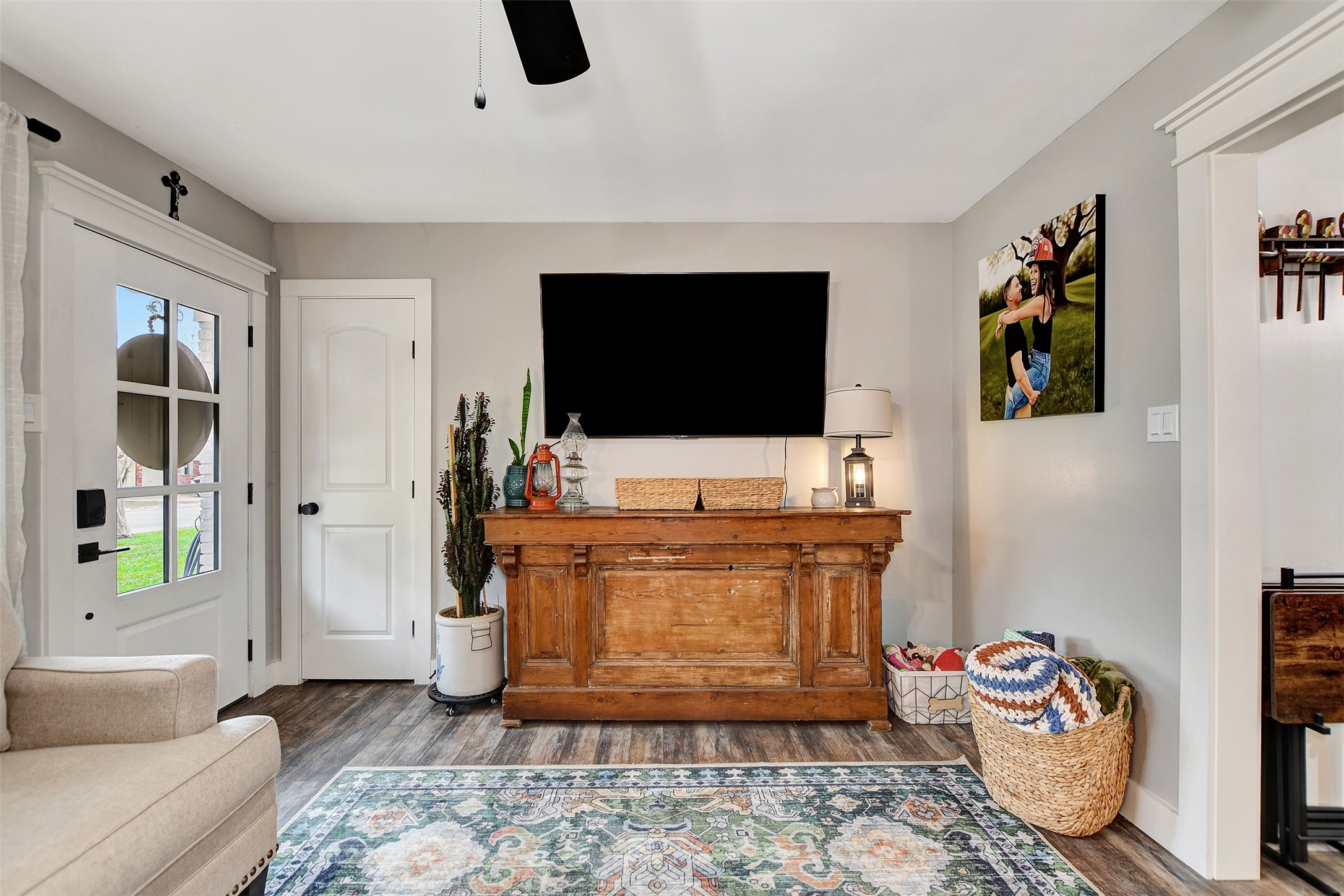 205 Munz Street Brenham, TX 77833 - Photo 9 of 48 a living room with furniture and a flat screen tv