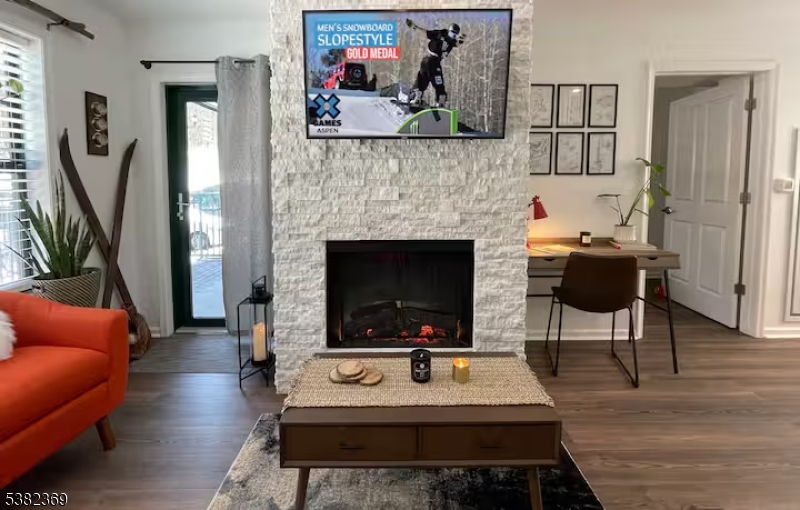 200 Highway 94 Vernon, NJ 07462 - Photo 1 of 25 a living room with furniture a fireplace and a flat screen tv