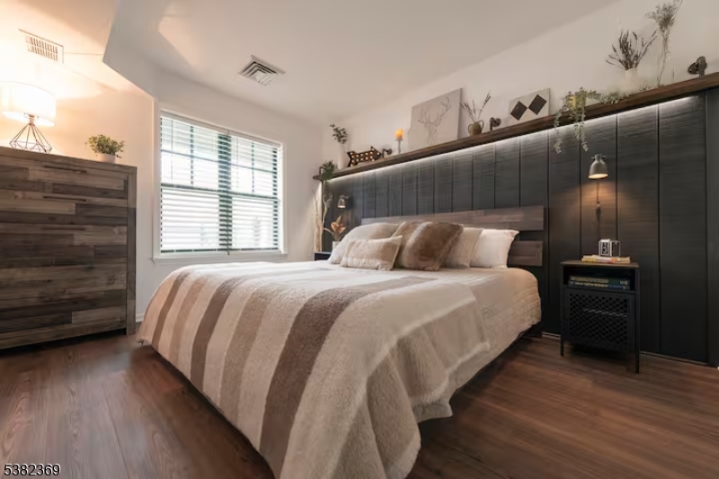 200 Highway 94 Vernon, NJ 07462 - Photo 19 of 25 a bedroom with a bed and wooden floor