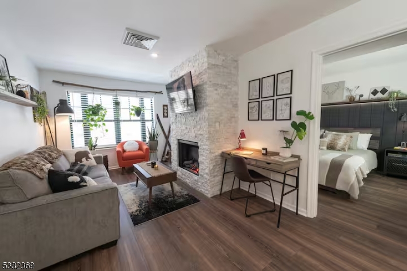 200 Highway 94 Vernon, NJ 07462 - Photo 7 of 25 a living room with furniture fireplace and a table
