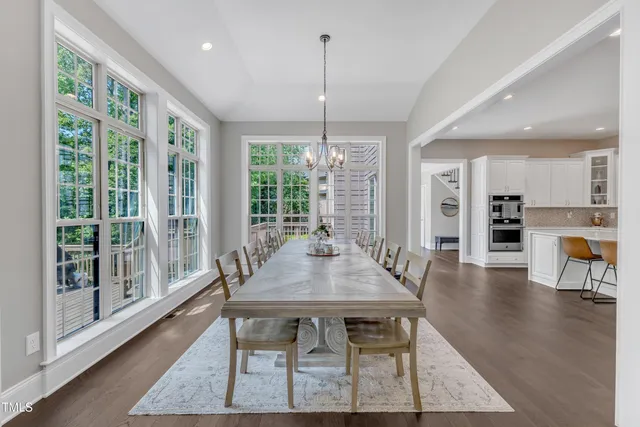 a view of a room with furniture and windows