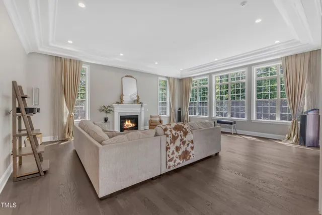 a bedroom with a bed and a ceiling fan