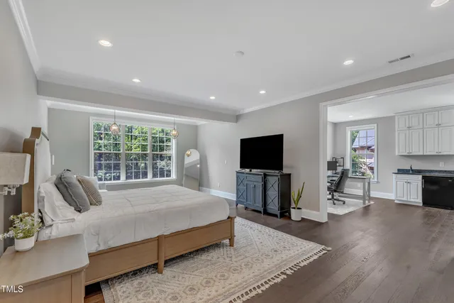 a view of a house with a big yard and large trees