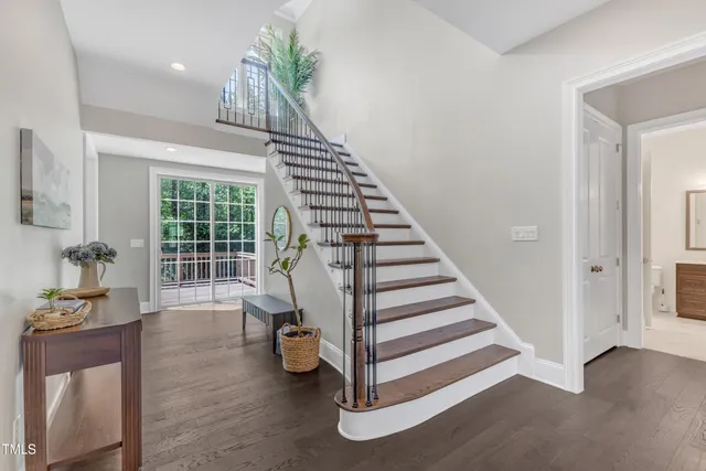 a kitchen with stainless steel appliances kitchen island granite countertop a stove a sink and a refrigerator