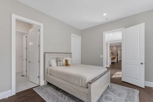 a large kitchen with kitchen island a large island in it