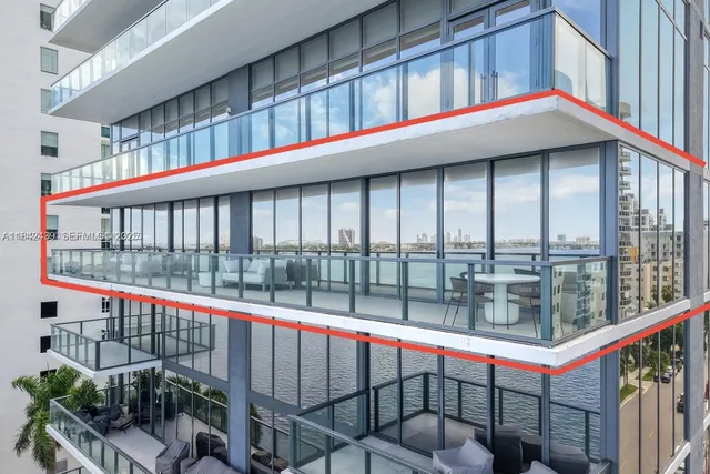 a balcony with an outdoor seating