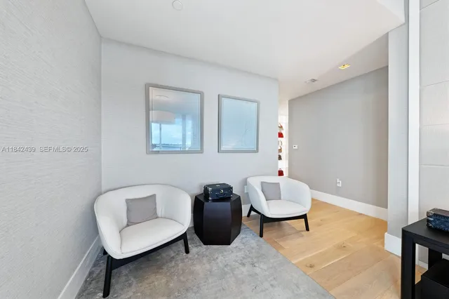 a bathroom with a shower and a mirror