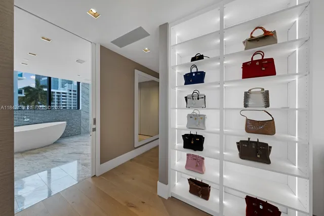 a living room with furniture and large windows