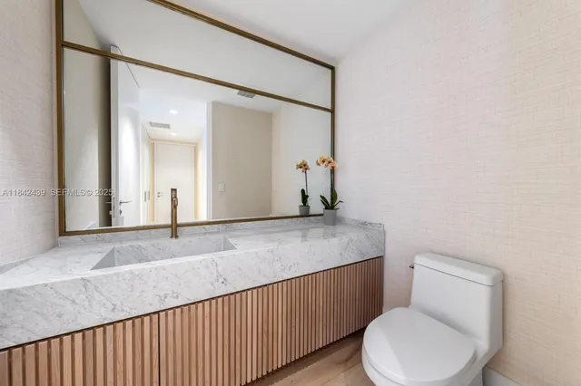 a bedroom with a bed and a chair