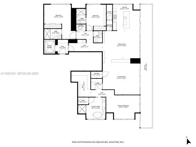 a large white kitchen with wooden floor and a fireplace