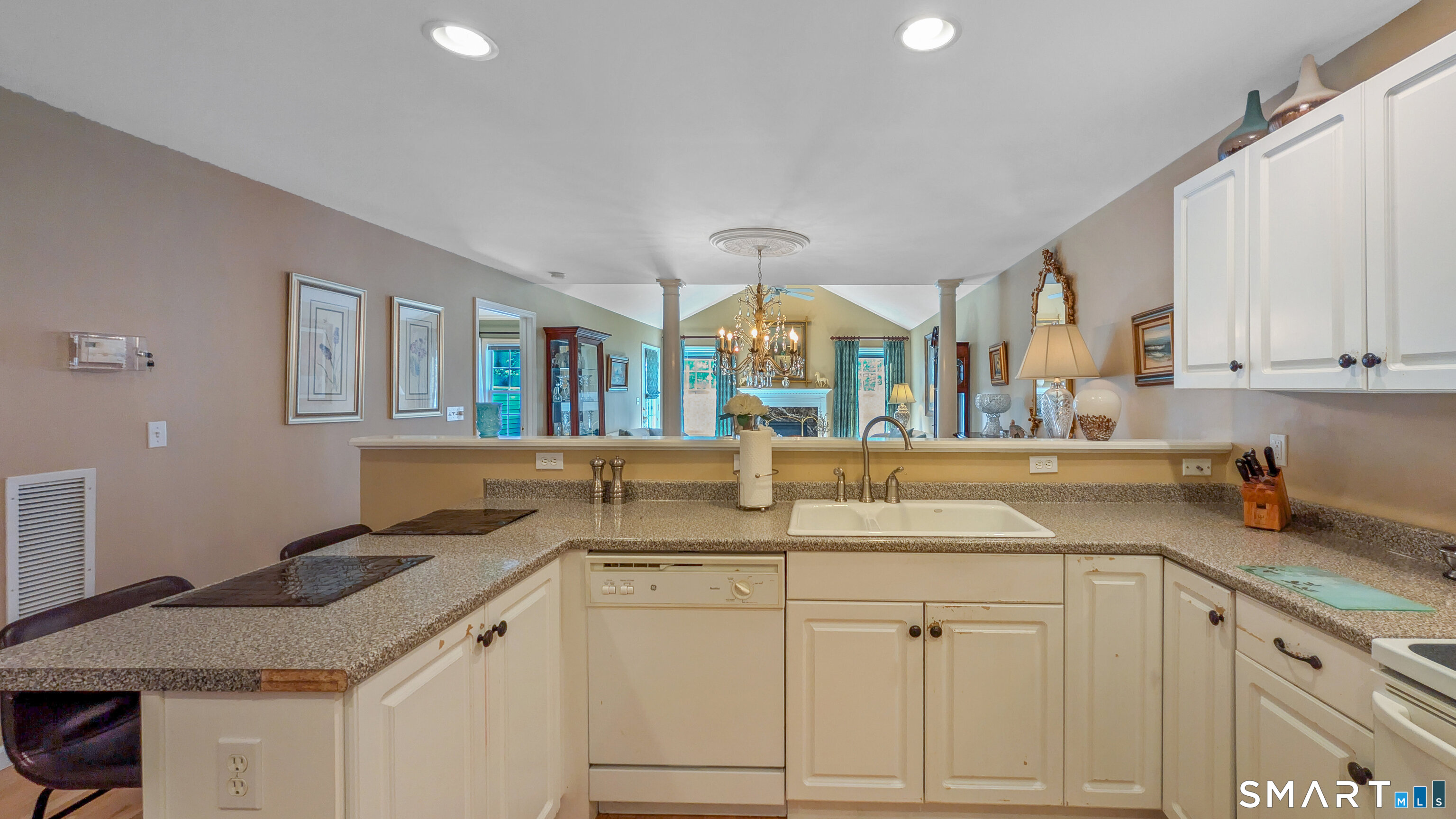 123 Louis Hill Road, Unit 123 Newtown, CT 06482 - Photo 11 of 35 a kitchen with granite countertop a sink and cabinets