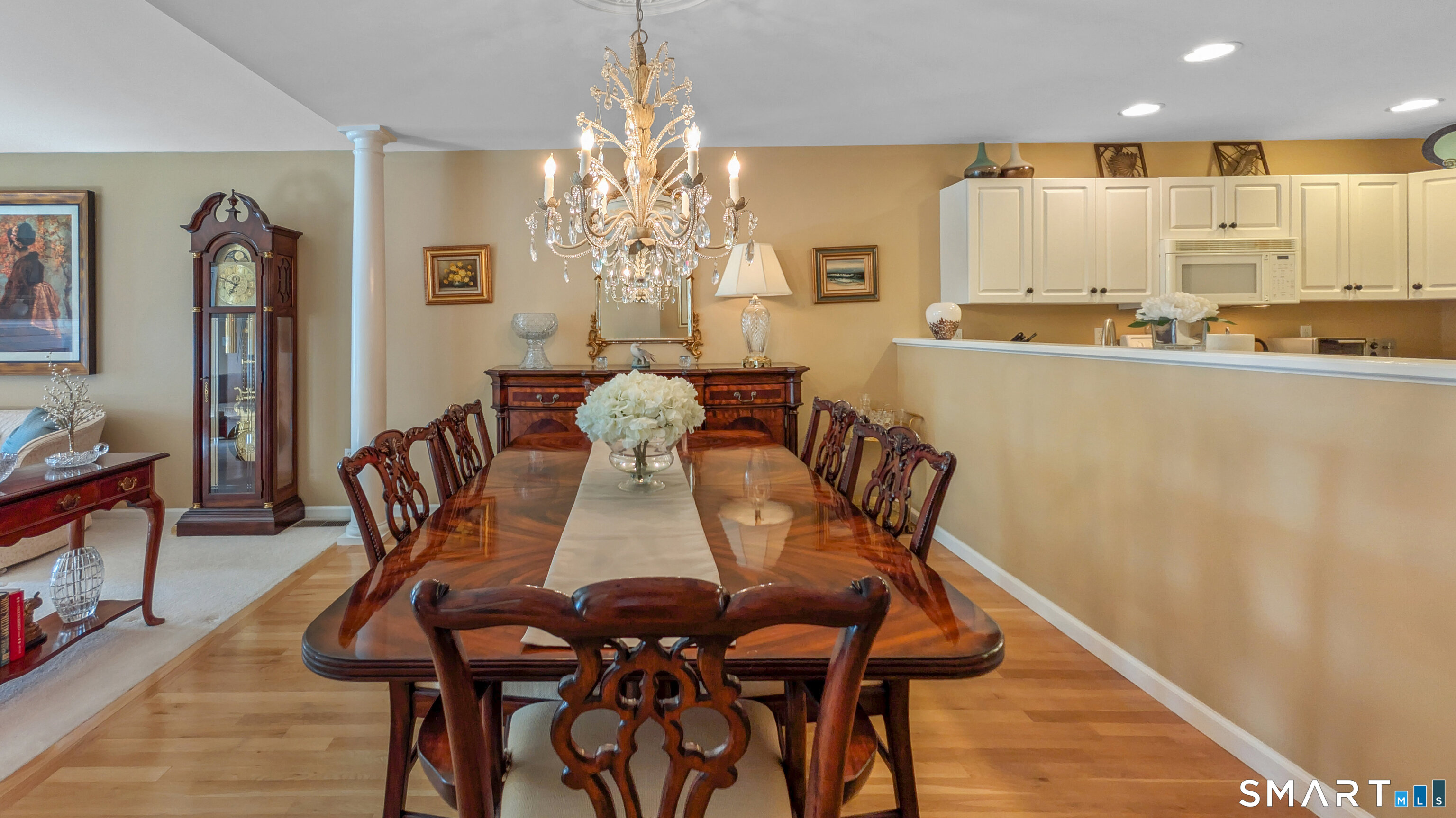 123 Louis Hill Road, Unit 123 Newtown, CT 06482 - Photo 12 of 35 a view of a dining room with furniture and chandelier