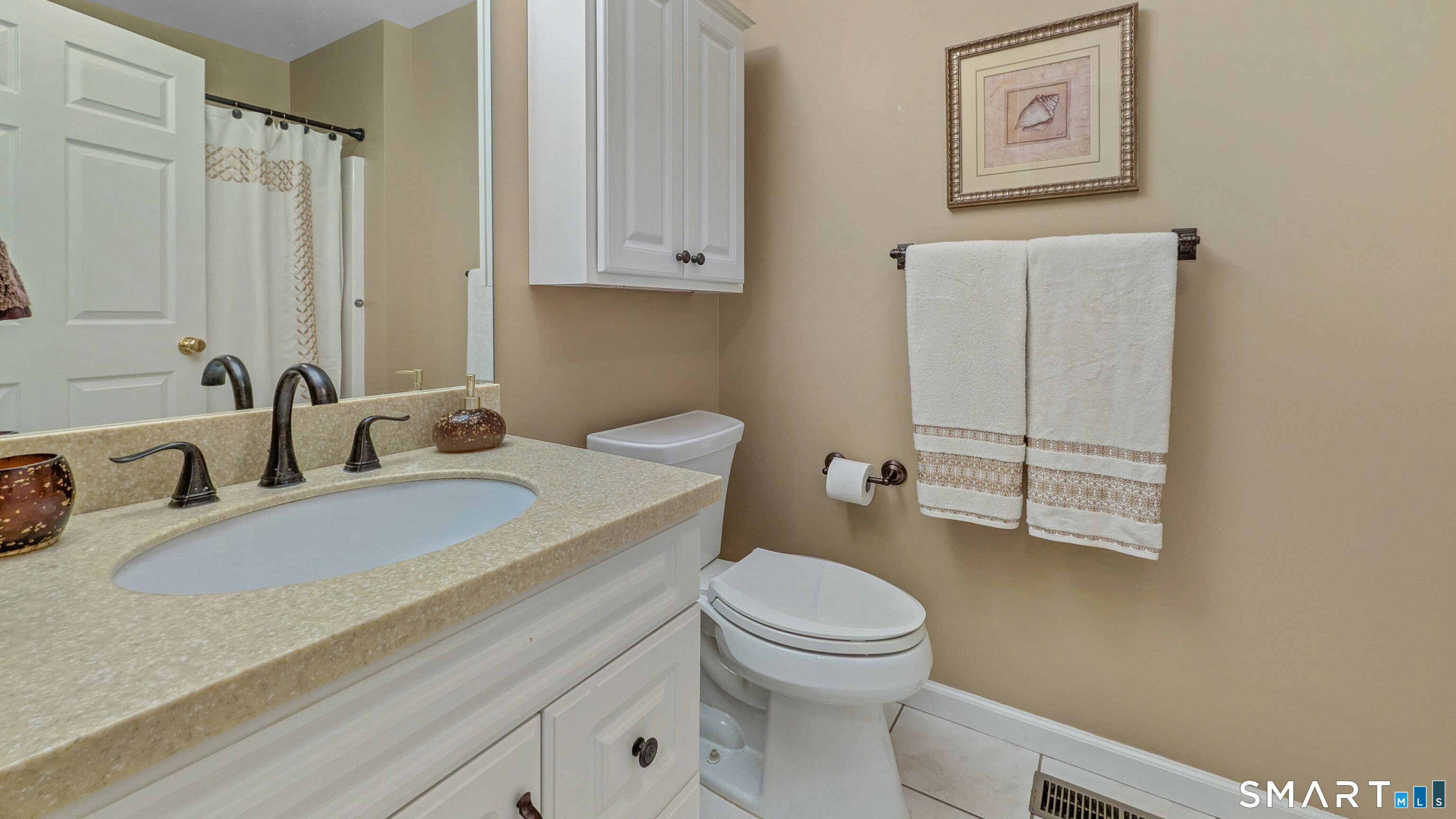 123 Louis Hill Road, Unit 123 Newtown, CT 06482 - Photo 14 of 35 a bathroom with a granite countertop toilet sink and mirror