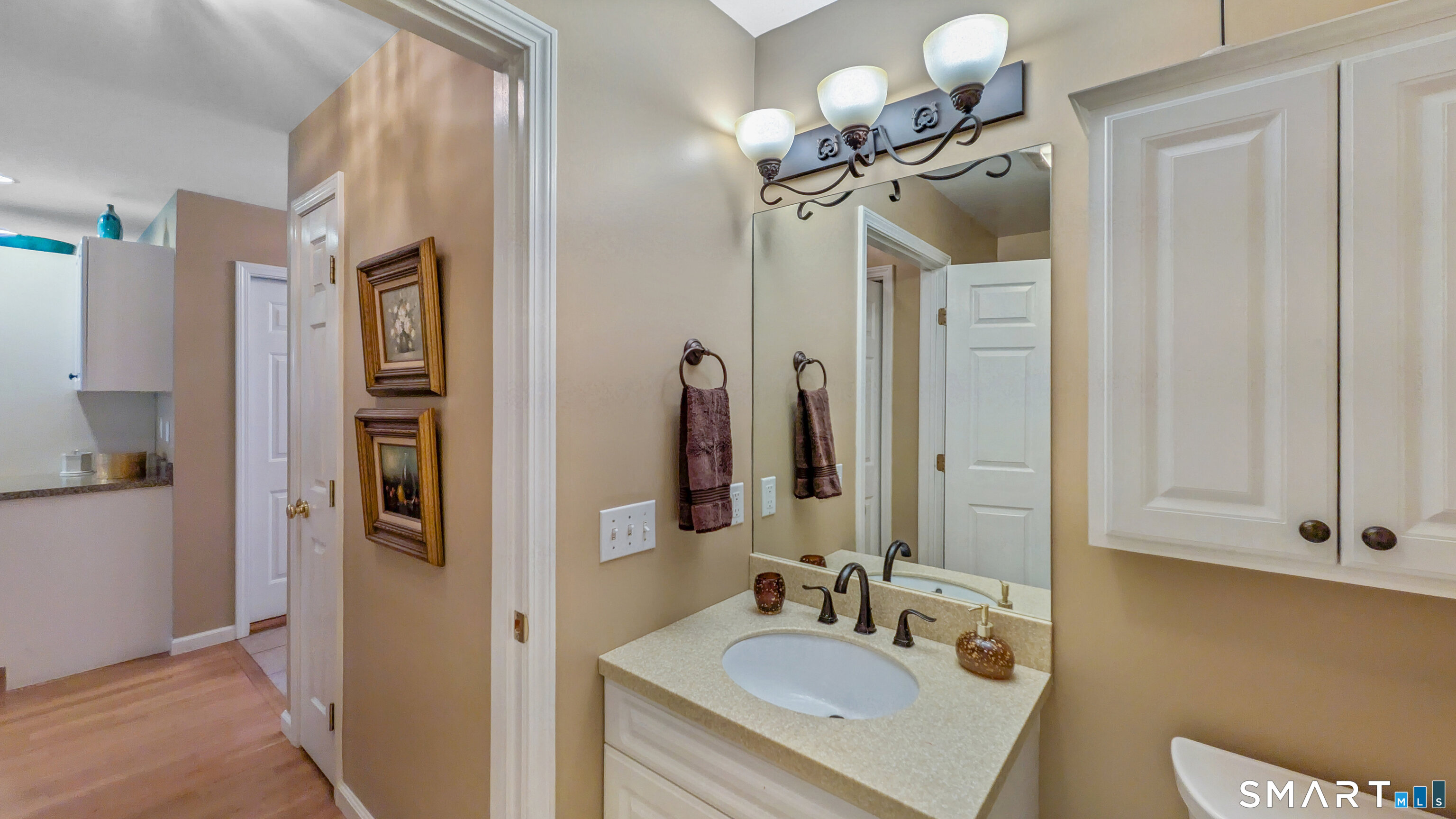 123 Louis Hill Road, Unit 123 Newtown, CT 06482 - Photo 15 of 35 a bathroom with a sink vanity granite and a mirror