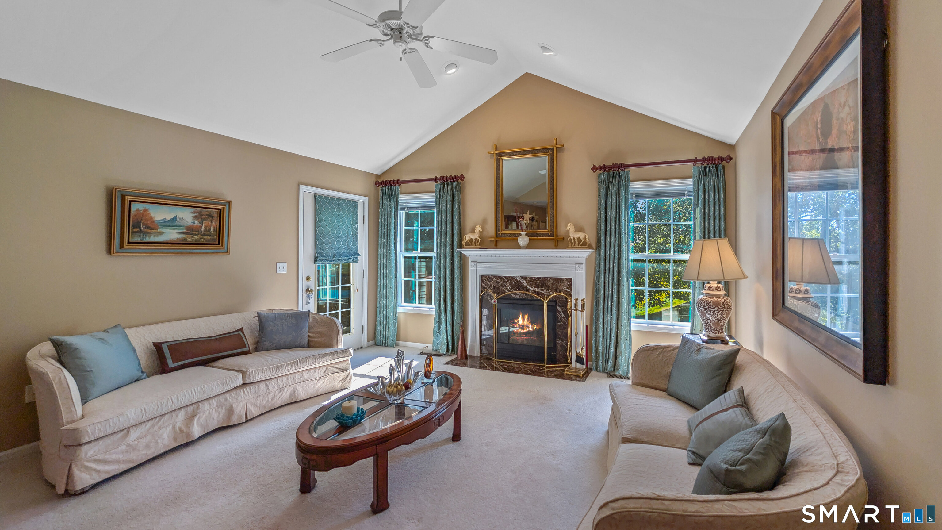 123 Louis Hill Road, Unit 123 Newtown, CT 06482 - Photo 2 of 35 a living room with furniture and a fireplace