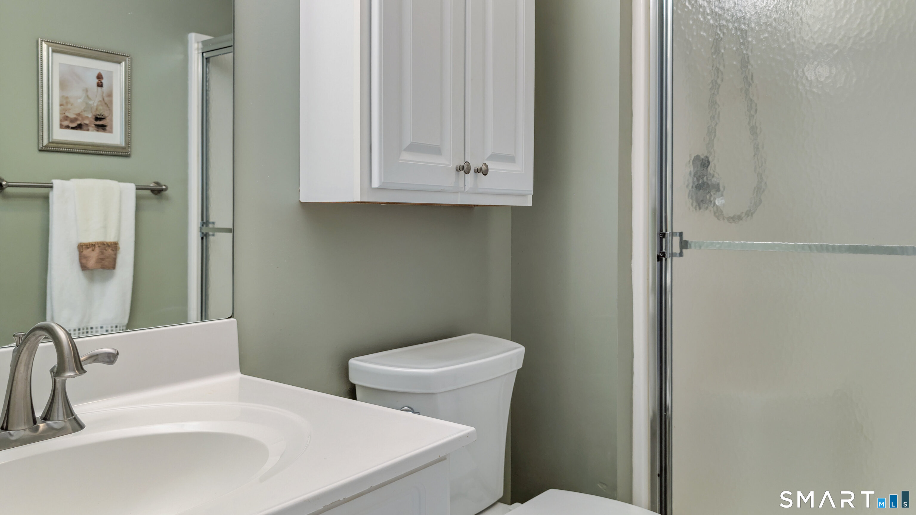 123 Louis Hill Road, Unit 123 Newtown, CT 06482 - Photo 22 of 35 a bathroom with a toilet sink and mirror