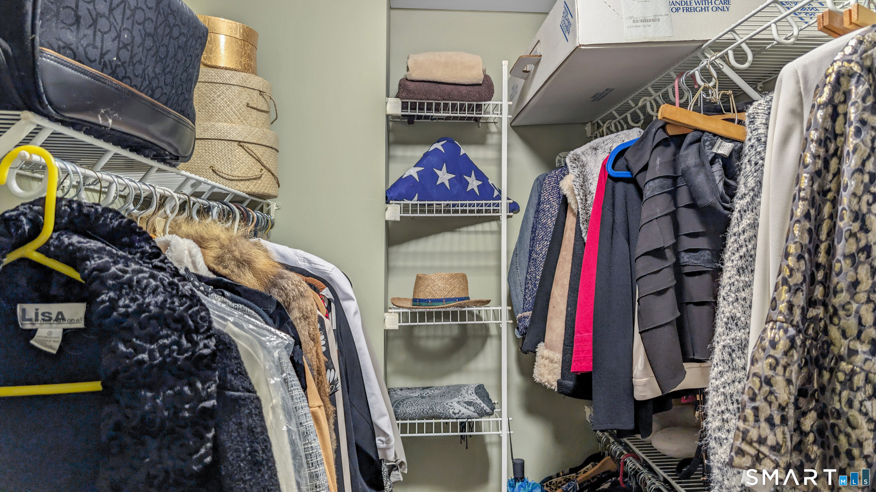 123 Louis Hill Road, Unit 123 Newtown, CT 06482 - Photo 24 of 35 a view of walk in closet with clothes and shoes