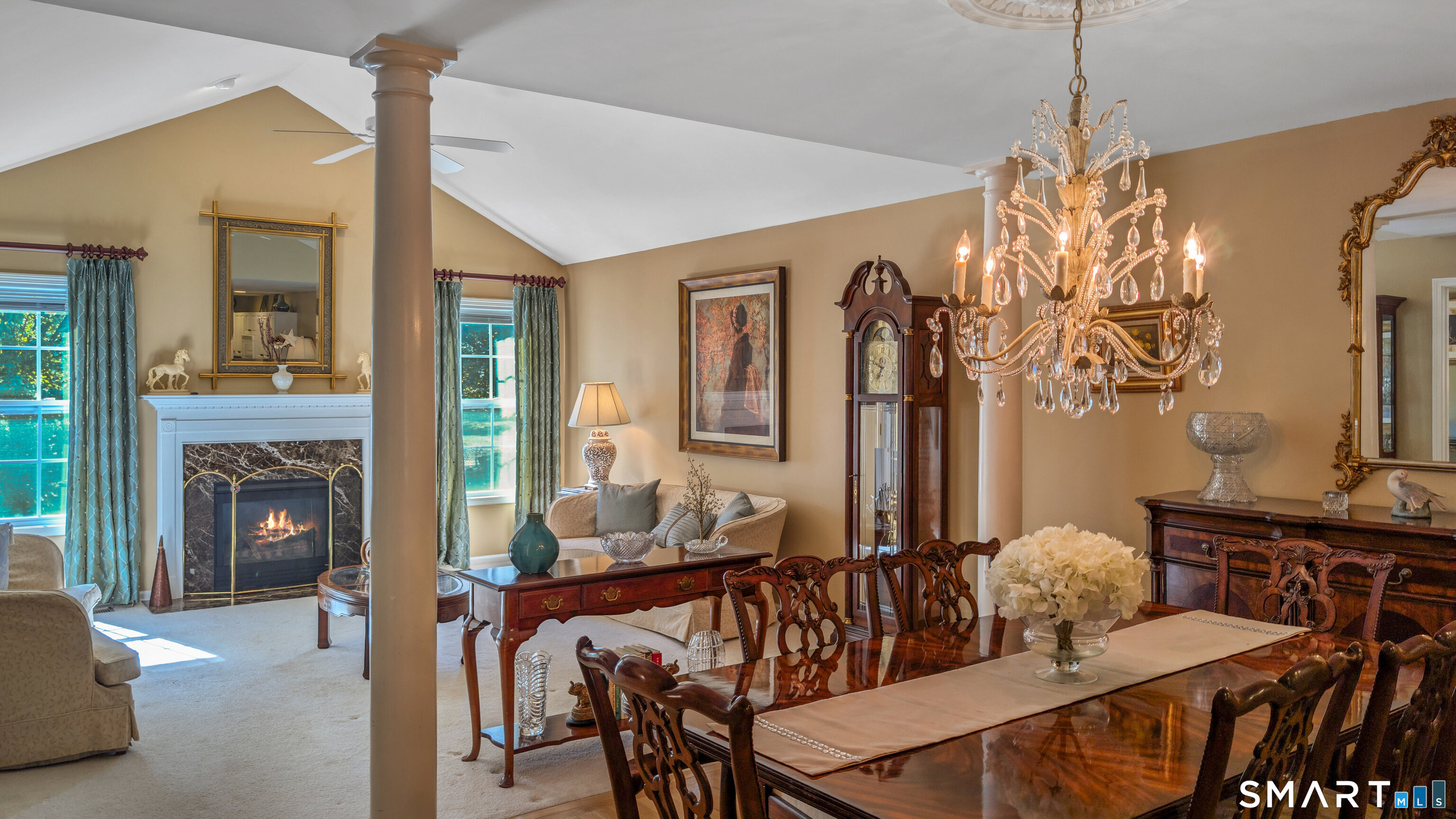 123 Louis Hill Road, Unit 123 Newtown, CT 06482 - Photo 4 of 35 a view of a livingroom with furniture and a fireplace